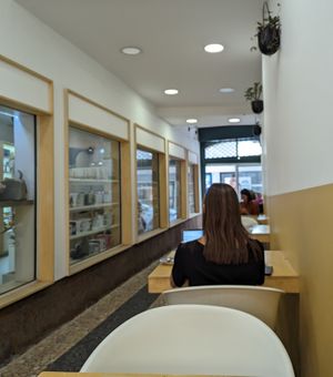 Outdoor covered seating adjacent to shop at Plano D in Funchal