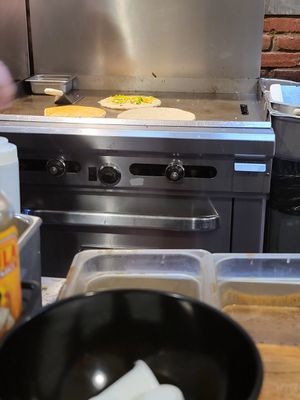 Savory pancakes in the making at Roasted in Bethlehem