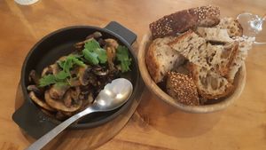 Mushrooms au vin with bread at Apuro Vegan Bar in Porto