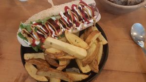 Hot dog and fries at Apuro Vegan Bar in Porto