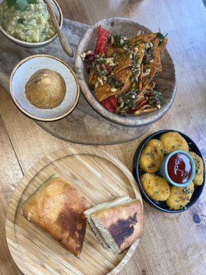 Drumstick, sandwich snack, no chicken nuggets and guac/salsa with corn and beetroot chips.  at Apuro Vegan Bar in Porto