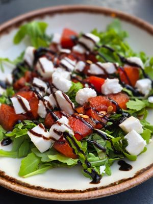 Grilled watermelon salad with feta cheese at Apuro Vegan Bar in Porto
