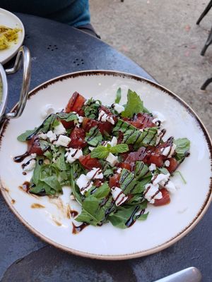 Grilled water melon with 'feta', mint and balsamic cream at Apuro Vegan Bar in Porto