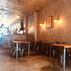 Tables inside  at Apuro Vegan Bar in Porto