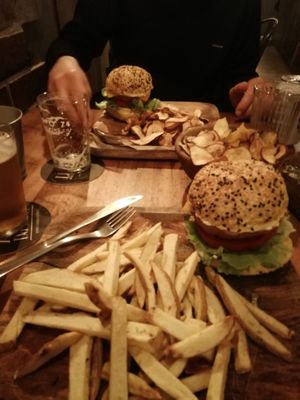 Non-chicken burgers and chips/sweet potato fries at Apuro Vegan Bar in Porto