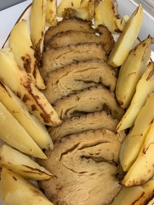 Roast seitan with potatoes at Come a Casa in Milan