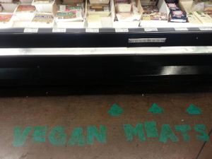 Vegan meat signage on the floor at Whole Foods Market - Robson in Vancouver