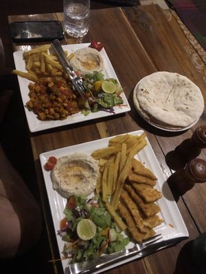 Vegan shakshuka + vegan schnitzel - the photo doesn’t do it justice. So good! at Nireas Healthy Haven in Palolem