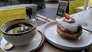 "Royal Sandwich" vegan doughnut and an americano at Perk Cafe in Inverness