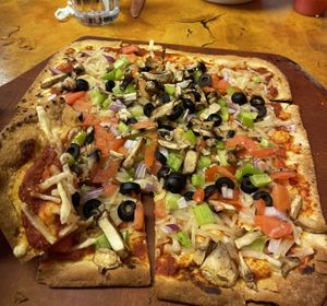 Thin crust pizza with vegan cheese.   at Creative Cafe in Casa Grande