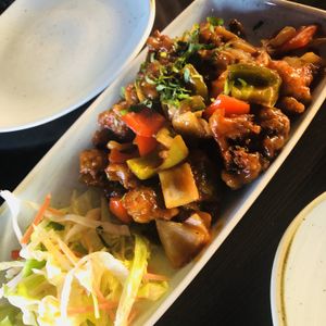 First time I’ve had this at a Indian restaurant. Starter to share of broccoli and cauliflower tamarind sauce in peppers and onions.  Really amazing! at Popadom in Chatham