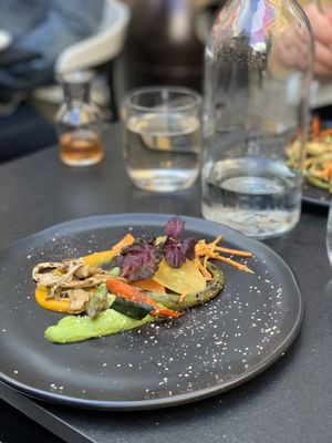 “From Our Garden” first plate. Carrot and asparagus purées with shiitake mushrooms, carrots, asparagus, kale chip. at L'Orygine in Quebec
