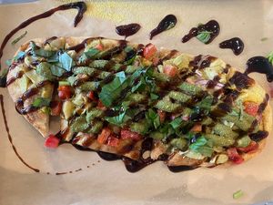 Pesto Artichoke Flatbread  at Revelations Cafe in Lutz