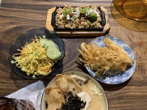(L-R) Asian slaw, sisig, tempura Enoki mushrooms, ramen. at Cosmic - Poblacion in Makati