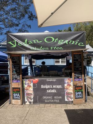 Menu on side includes salads, wraps and burgers  at Hempburger - Market Stall in Eumundi