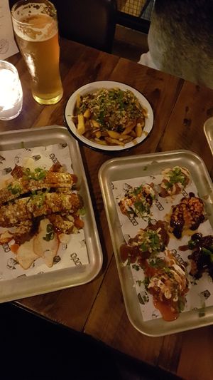 Corn ribs, poutine, assortment of wings at Biff's x Brewdog - Dalston in North London