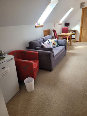 Common lounge with refrigerator for free use at Kings Reach Self Catering in Lochgilphead