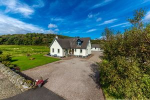 Kings Reach with cottages behind. at Kings Reach Self Catering in Lochgilphead