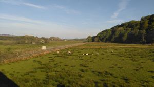 The view from the bedroom window to historic Dunadd Hill Fort.  at Kings Reach Self Catering in Lochgilphead