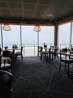 From the inside,  pleasant seating with view at Coolum Surf Club in Coolum Beach