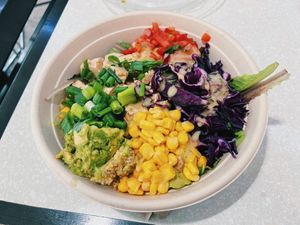Bowl with quinoa, tofu, tomato, corn, lettuce, scallions, avocado, and vinaigrette. Bland, but will get the job done. at IAH - freshii - TB in Houston