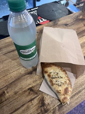 Agua con gas & vegan empanada  at Volver in Girona