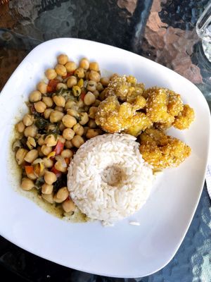 My set menu main - “legume stew of the day + cauliflower wings”. The chickpeas were cold but otherwise everything was tasty! (Cauli wings a bit of a random combo.)  at Prana Vegan in Arequipa
