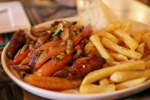 vegan lomo saltado at Así Es Mi Peru in Oranjestad