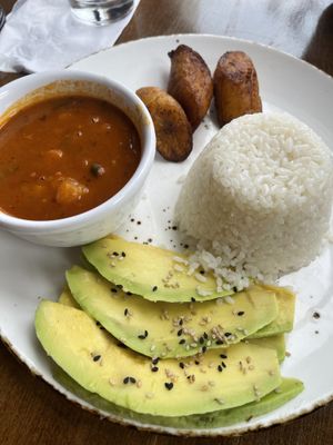 Rice, beans, avocado and plantains that come with the Ropa Vieja Vegana at Cafe Berlin in San Juan