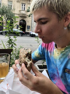 Happy guy with his pita at Hummus Bar Vegetarian in Budapest