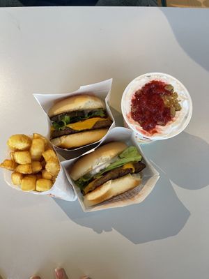 Two cheeseburgers, fries and a strawberry cheesecake shake   at Next Level Burger - Austin in Austin