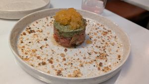 Beef tomato tartar, avocado mousse, crispy caramel black sesame seed, tomato pearl at Avit in Athens