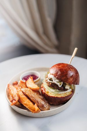 Truffle cheeseburger with brioche bun, pickles, iceberg, truffle mayo, f*cking fries, beetroot ketchup at Avit in Athens
