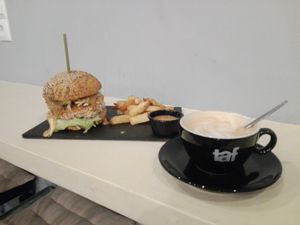 THE burger and a vegan cappuccino at Avit in Athens