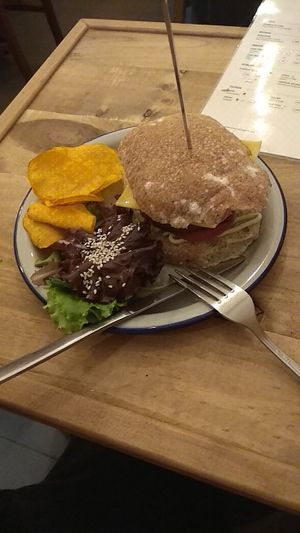 Special Edition Burger with vegan "cheese" and some chips at Las Vegan in Lisbon