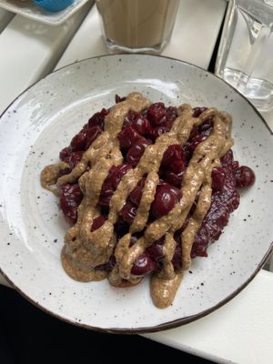 So this is half a portion of pancakes. This one topped with raspberry jam, cherries and almond butter  at Ćao Šećeru in Belgrade
