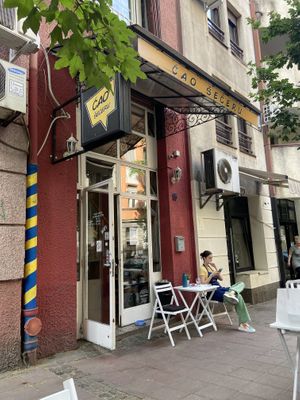 Seen from the outside. Cute place with outdoor seating on sidewalk  at Ćao Šećeru in Belgrade
