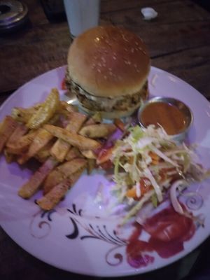 Veg vegan burger. The sauce is tahini. at Rest Point Cafe in Pokhara