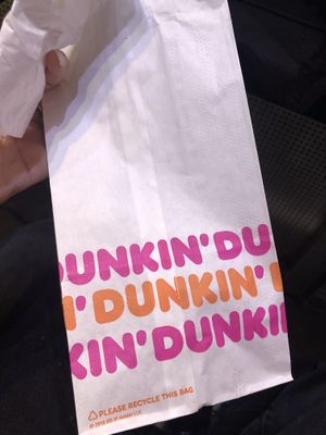 donuts served on parchment paper and placed in a recyclable paper bag instead of a plastic bag at Dunkin' Donuts - Far East Plaza in Central Singapore