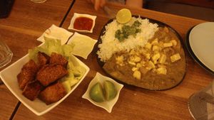 veggie curry with delish tofu, and shnitzel pieces on the side at Shakti in Beer Sheva