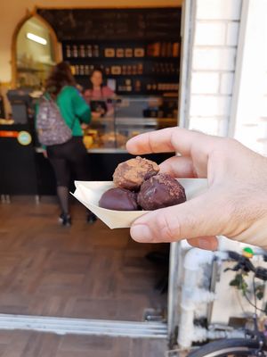 My sweets with store in background at COCO Vegan Chocolate in Tel Aviv