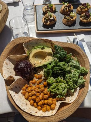 Plant Power bowl: Groats, crunchy chickpeas, kale, avocado, beetroot, black sesame,
nutritional yeast, tortilla, lemon dressing at Galini Cafe in Santorini