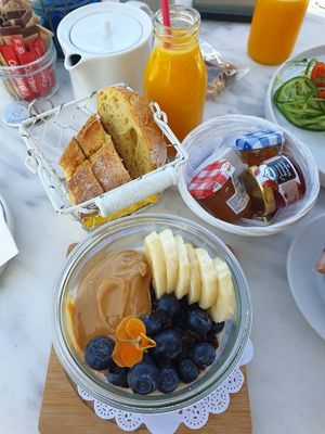 Porridge with dark chocolate granola, berries, and peanut butter  at Galini Cafe in Santorini