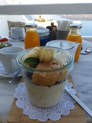Porridge with dark chocolate granola, banana, and peanut butter at Galini Cafe in Santorini