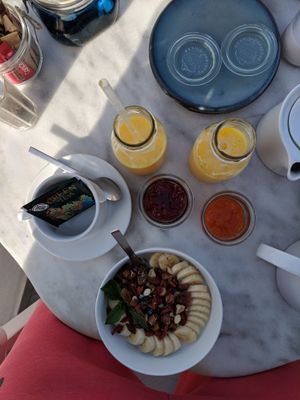   Vegan oatmeal bowl, juices, jams, and green tea.... at Galini Cafe in Santorini