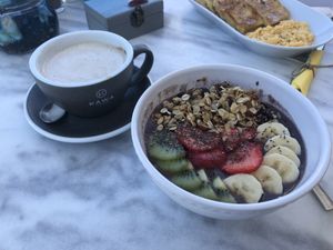 Açaí bowl and vegan cappuccino  at Galini Cafe in Santorini