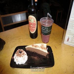 Yummy vegan chocolate cake and berry smoothie! at InSpiral Lounge in North West London