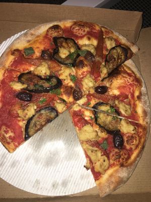 Vegan pizza parmigiana, with coconut cheese, eggplants, olives and tomato sauce at Pizza Street - Putuo District in Shanghai