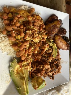 The Latin Plate with Jackfruit Pernil plantains beans rice and avocado   at Arles and Boggs  in Wallingford
