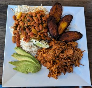 Jackfruit "pernil" (pulled pork without the pig), sweet plantain, beans, avocado: lovely to think about, look at, and eat. at Arles and Boggs  in Wallingford